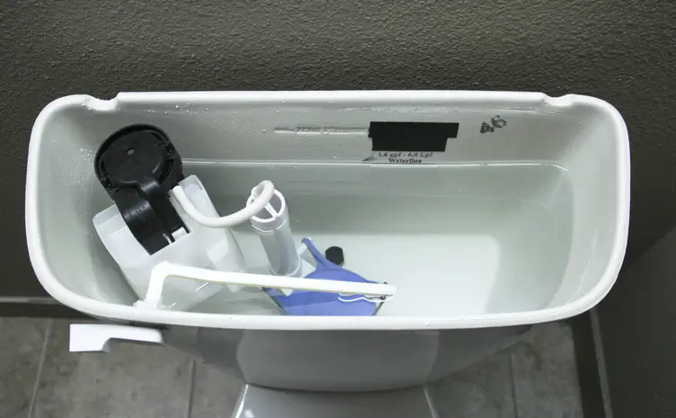 internal plumbings of a toilet back tank
